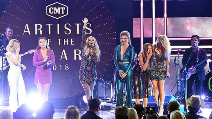 Carrie Underwood performs on stage at the 2018 CMT Artists of the Year with Maddie & Tae and Runaway June