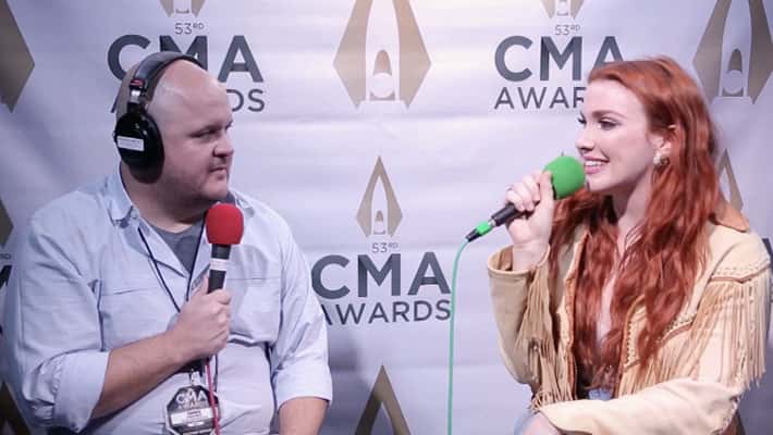 Caylee Hammack talks with Ryan Wild at the CMA Awards