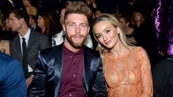 Chris Lane and his girlfriend Lauren Bushnell posing at the 52nd annual CMA Awards