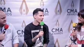 Devin Dawson talks with Ryan Wild and Cara at the CMA Awards
