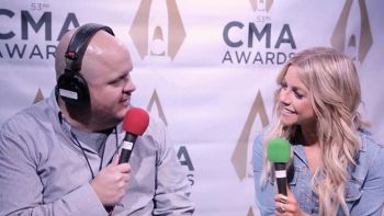 Lindday Ell talks with Ryan Wild at the CMA Awards