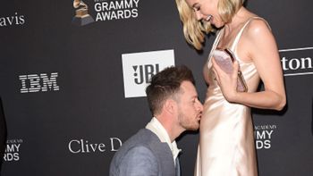 FGL's Tyler Hubbard kissing wife Hayley's stomach at the Grammys