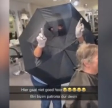Hilarious Dutch Hairdresser makes corona-virus shield with an umbrella