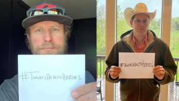 Dierks Bentley and Jon Pardi holding up signs that say #ThanksHealthHeroes