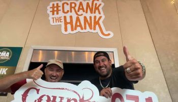 CW and Caleb holding the HANK-FM sign