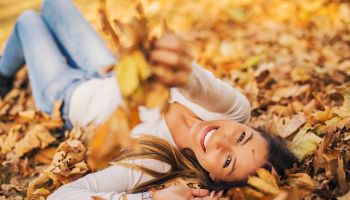 Woman laying in leaves