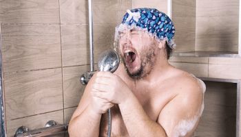 Funny fat man sings in the shower