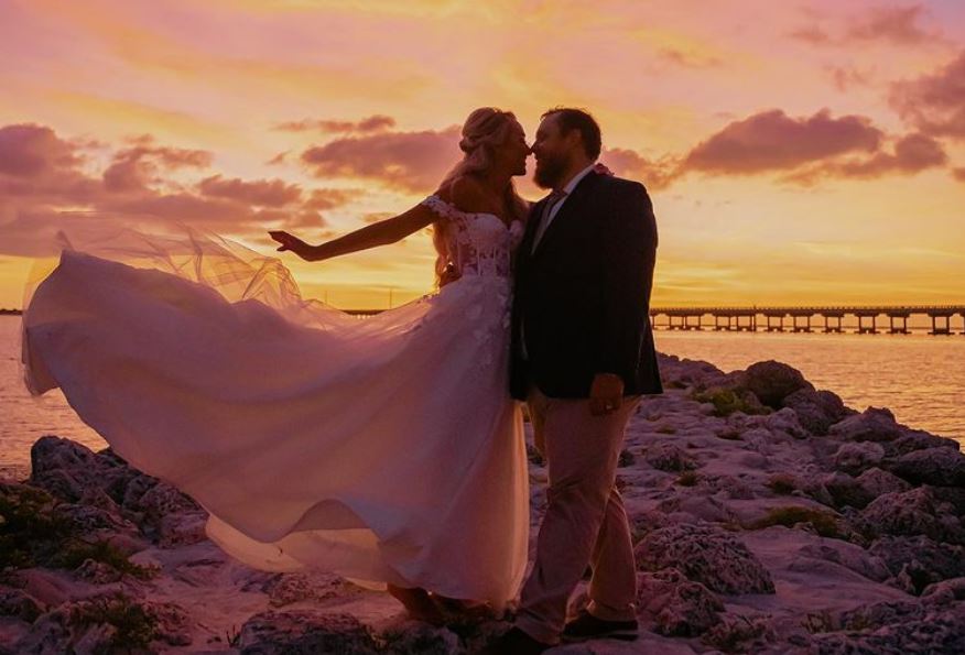 Luke combs and wife at the beach for their wedding