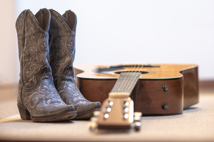 country boots and acoustic guitar