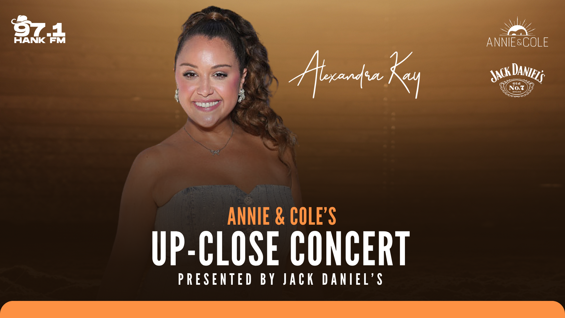 A smiling woman with curly hair wearing a strapless black dress, with "Annie & Cole's Up-Close Concert" text and logos for 97.1 Hank FM, Annie Cole, and Jack Daniel's.