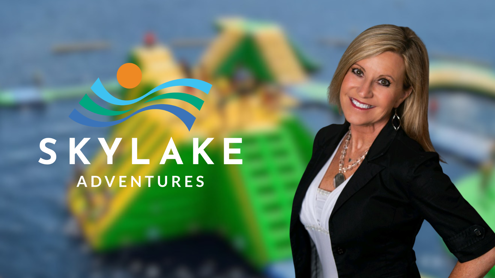 A smiling woman in a black jacket stands in front of a logo for "Sky Lake Adventures".